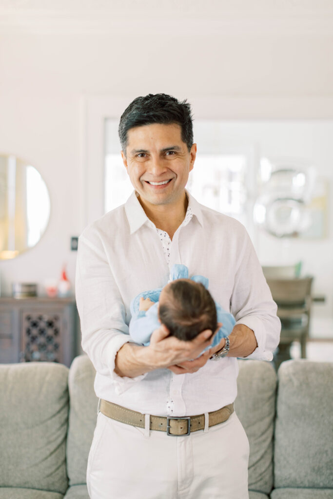 dad holding newborn son