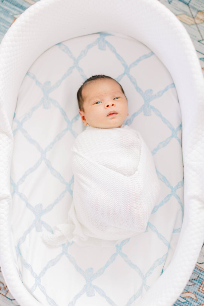 newborn baby in a bassinet