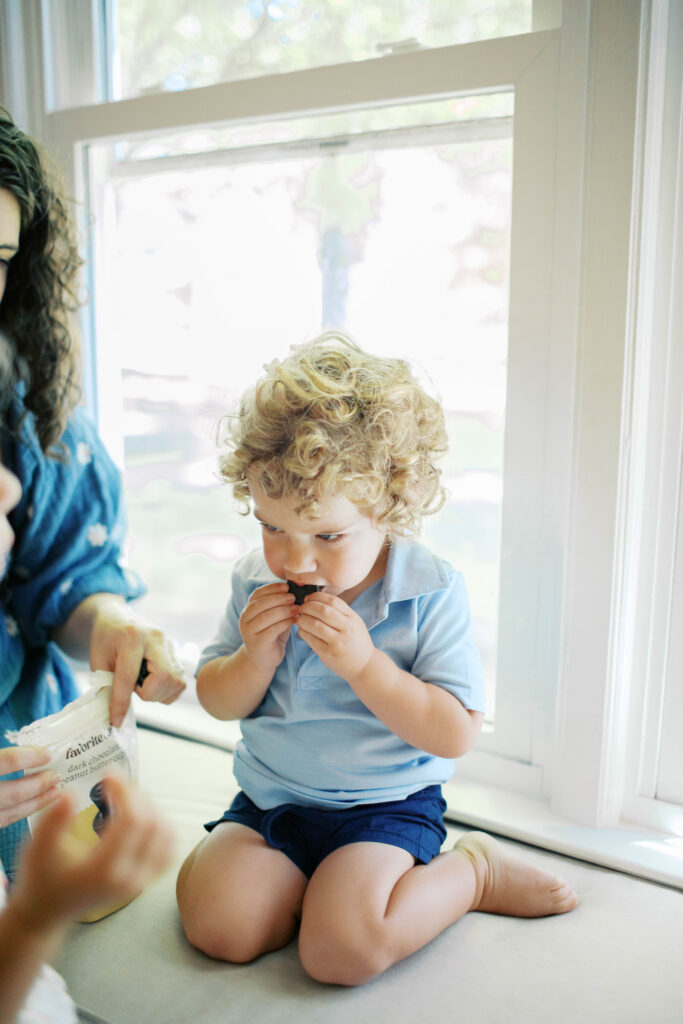 little boy eating snacks 
