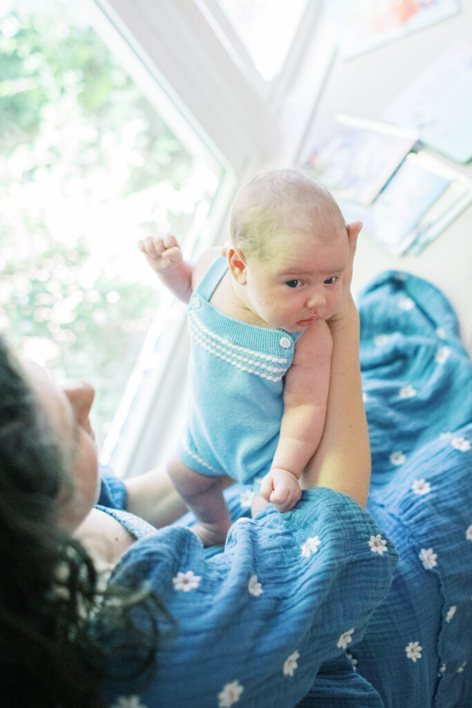 mom holding infant 